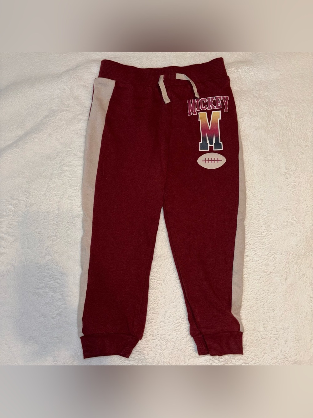 Disney Maroon Sweatpants with Cream Side Panels and 'M' Graphic